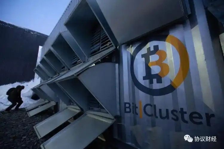 A large mining farm with rows of servers, possibly using immersion cooling technology.